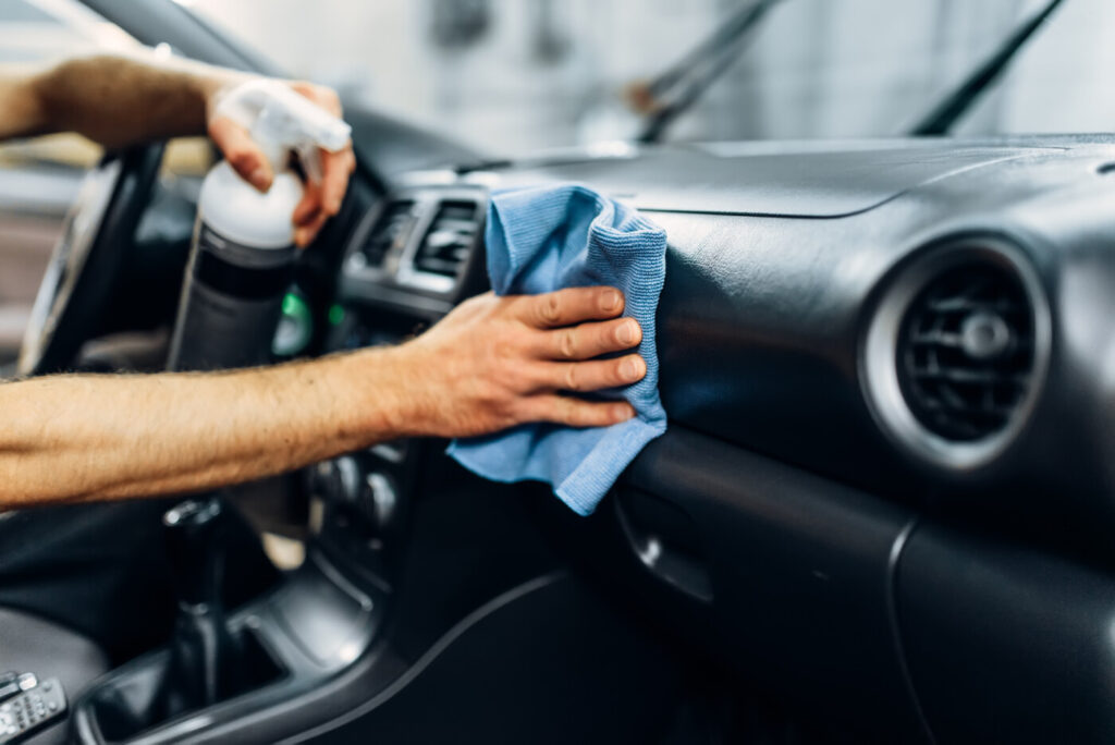 Car Interior Detailing in San Diego: What Sun, Salt, and Sand Actually Do to Your Cabin detailing, cleaning salon with polishing spray